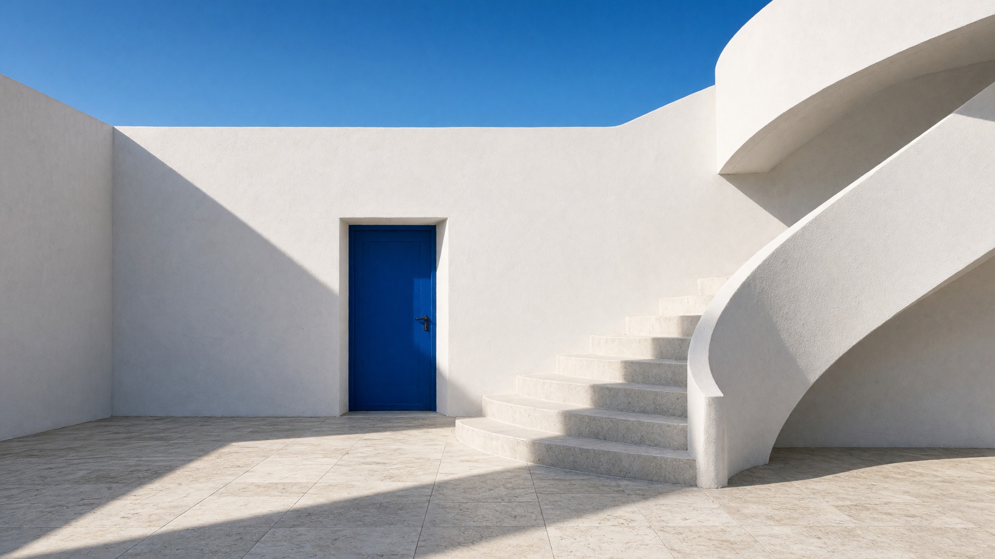 White courtyard and sculptural stairs in crisp daylight, with a cobalt-blue doorway.